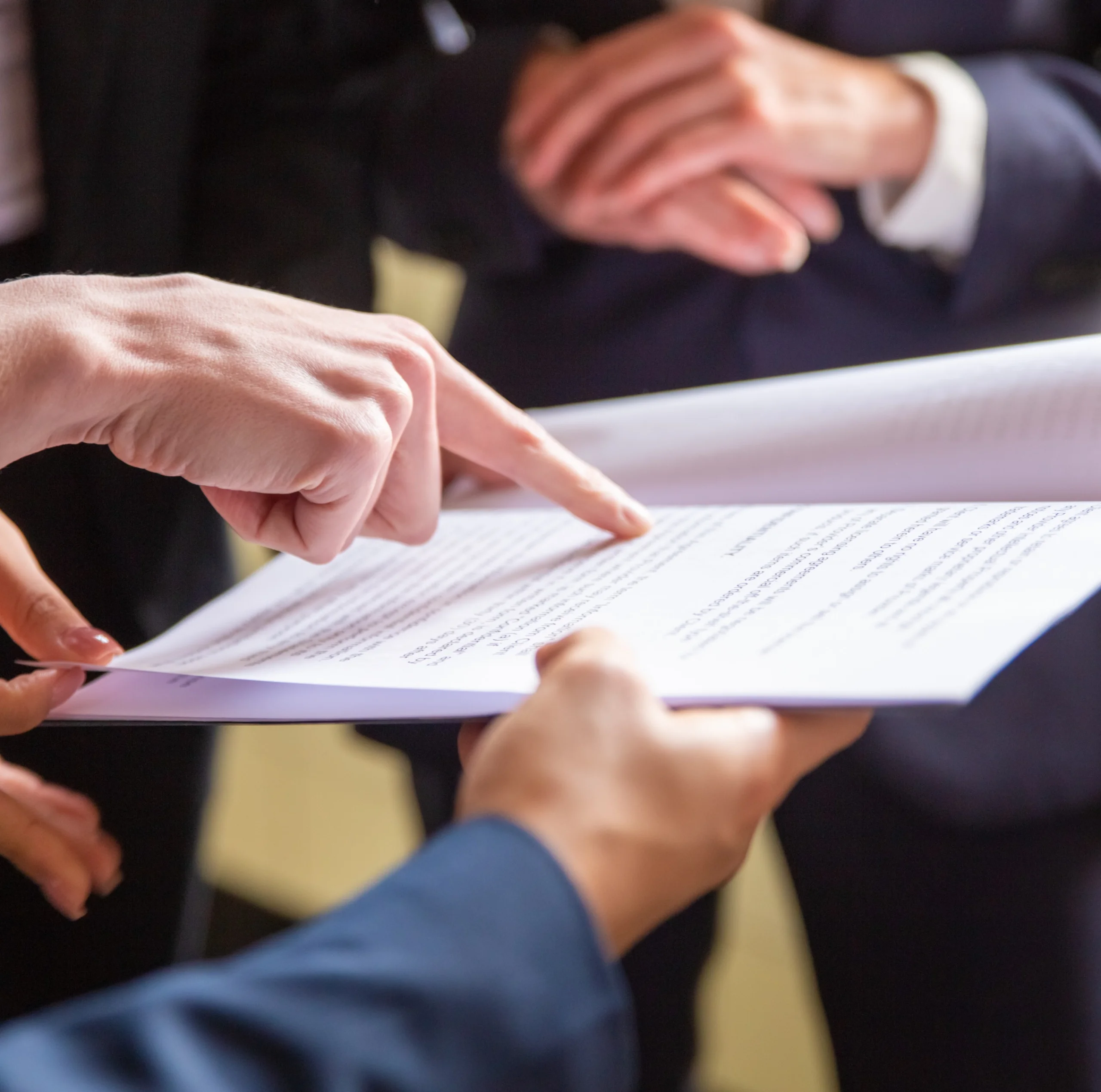 cropped-view-businesswomen-reading-document.jpg